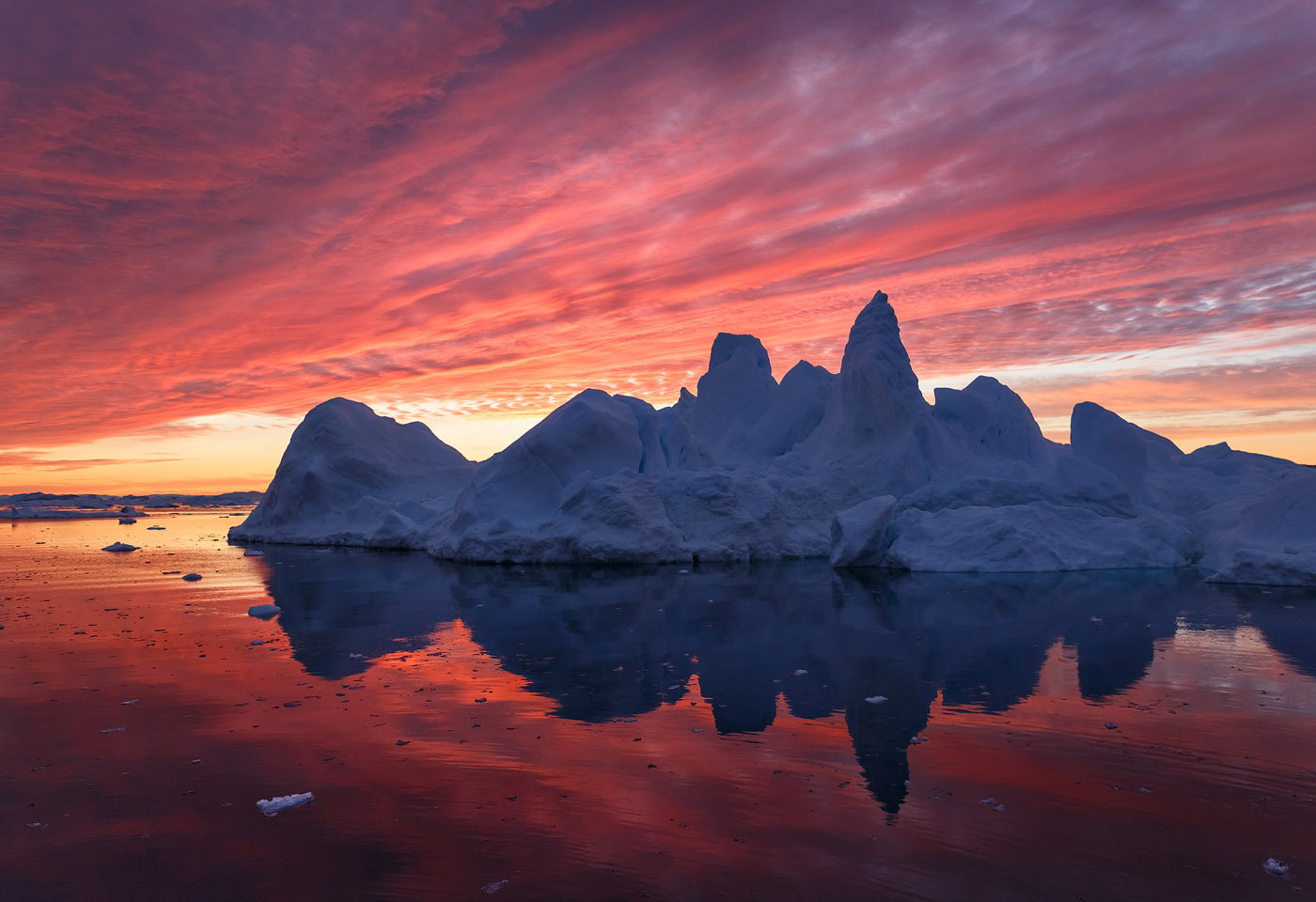 Spires Of The Arctic Night A Spiky Iceberg Reflecting In The Waters