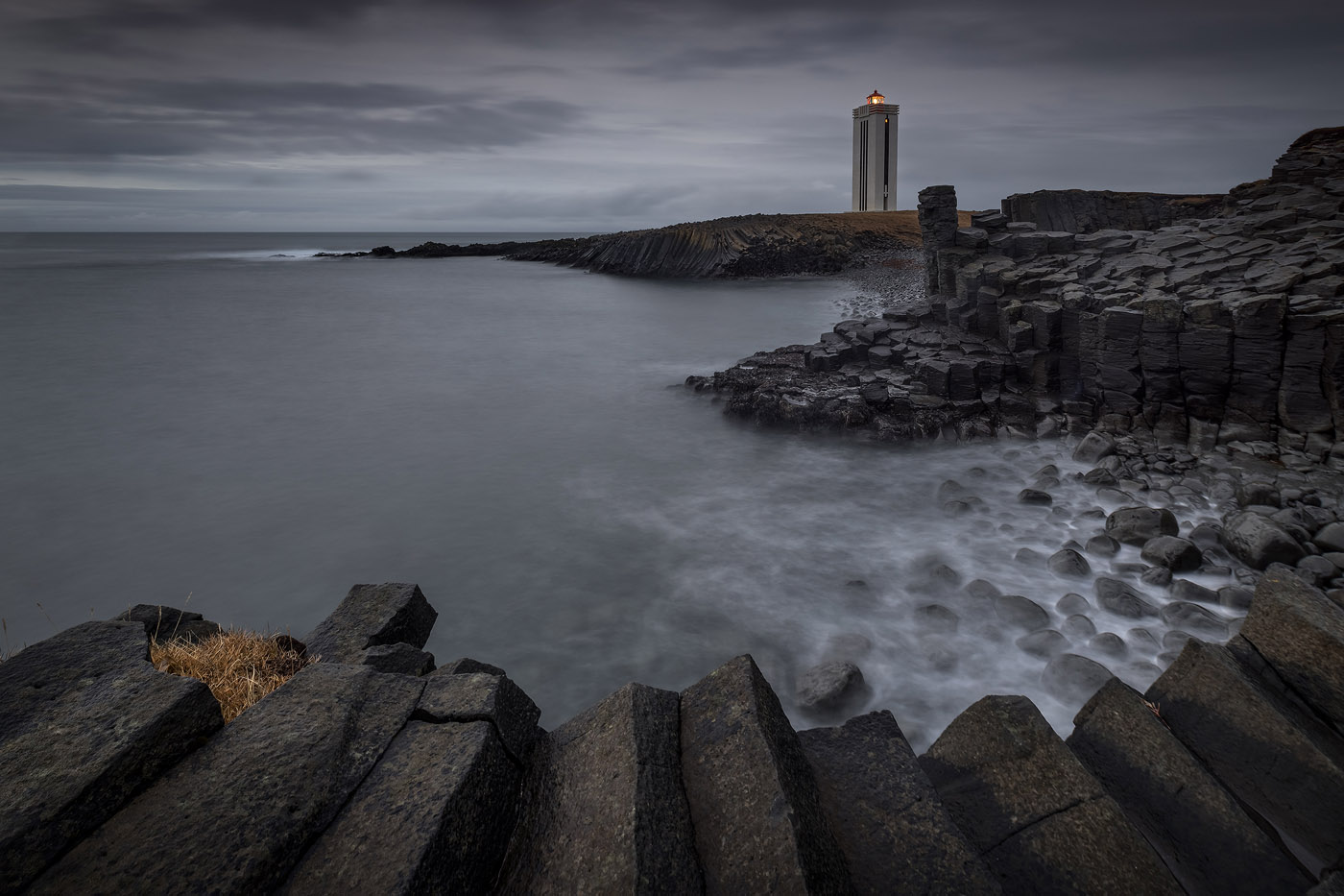 Light in the Dark - A gloomy, mysterious sunset over the basalt columns