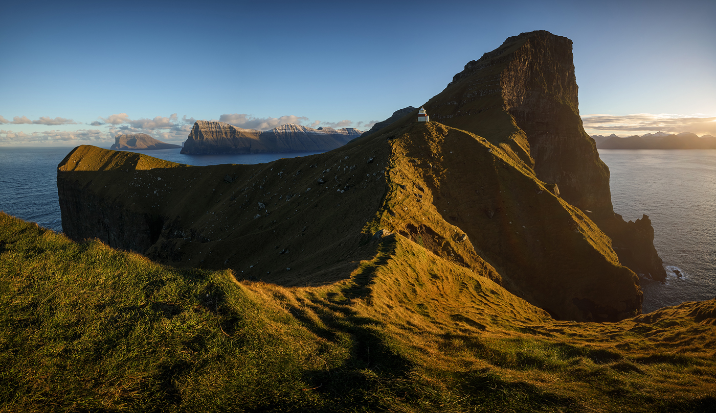 Kallur Pano - Late afternoon sun shines upon the grassy slopes of ...